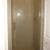 Polished Brass Frameless Shower Door using Top/Bottom Pivots and
Deluxe Pull Handle